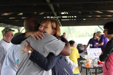 Two people embracing with a hug