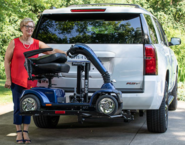 Exterior scooter carrier mounted to vehicle hitch receiver