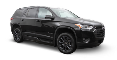 Wheelchair accessible Chevrolet Traverse handicap SUV with BraunAbility power in-floor ramp. Exterior view of front and passenger side of vehicle with wheelchair ramp stowed and doors closed.