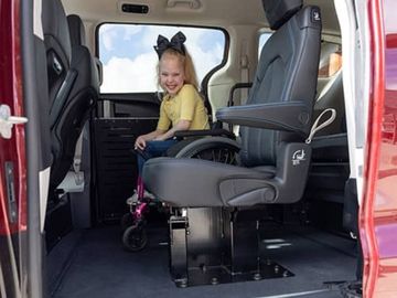 Second-row jump seat in the BraunAbility CompanionVan wheelchair van as viewed from outside the driver-side sliding door