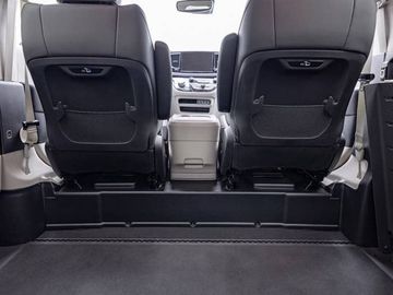Front-row seats and center console of the BraunAbility CompanionVan as seen from the second row of the wheelchair van