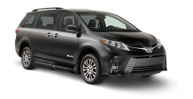 Wheelchair accessible Toyota Sienna Hybrid handicap van with BraunAbility power fold-out ramp. Exterior view of front and passenger side of vehicle with wheelchair ramp stowed and doors closed.