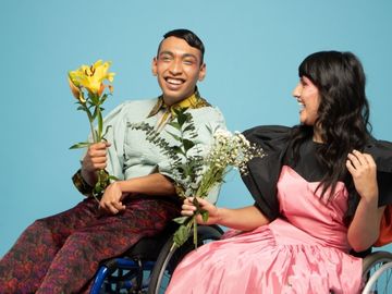 Person with cerebral palsy holding flowers