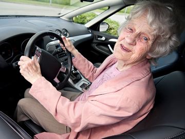 Older adult driving a vehicle