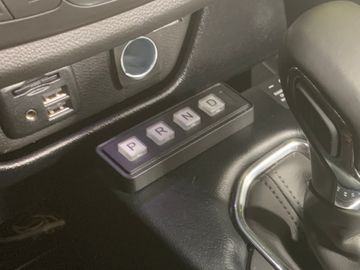 Key pad for electronic gear shift selector installed in a vehicle