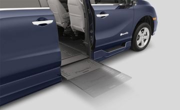 In-floor wheelchair ramp deploying from passenger-side sliding door of a BraunAbility Honda Odyssey wheelchair van