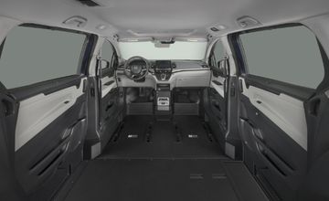 Interior cabin of a BraunAbility Honda Odyssey wheelchair van with the driver and front-passenger seats removed