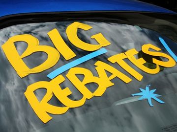 Customer considering manufacturer rebate options for a wheelchair van