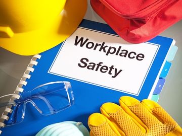 Construction worksite safety gear and workplace safety notebook
