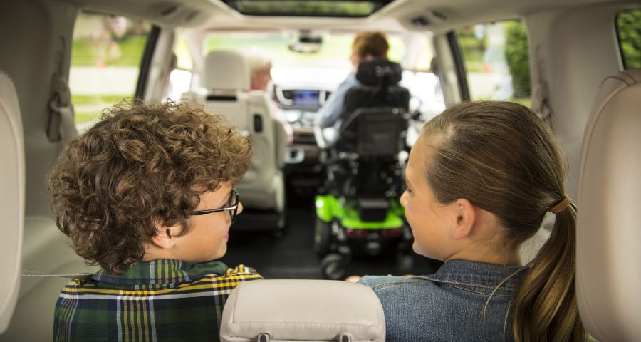 Family driving in a wheelchair accessible van.