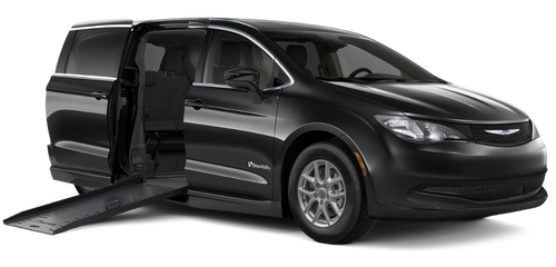 A black Chrysler Pacifica wheelchair accessible van with a side-entry fold-out ramp extended from the passenger-side sliding door. The van features a BraunAbility CompanionVan (CV) conversion, offering reliable manual ramp operation and easy wheelchair access, shown on a white background.