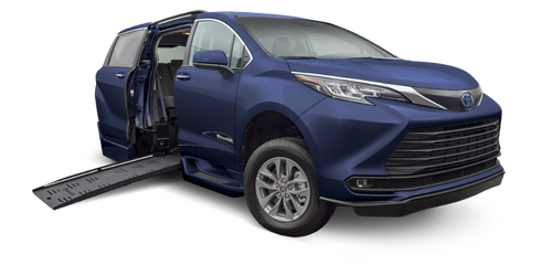 A blue Toyota Sienna wheelchair accessible van with a side-entry power fold-out ramp extended from the passenger-side sliding door. The van features a BraunAbility XT conversion, designed for extra-tall wheelchair users, and is displayed on a white background.
