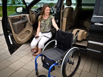 Adapt Solutions Speedy-Lift system lifting and storing a manual wheelchair inside a vehicle