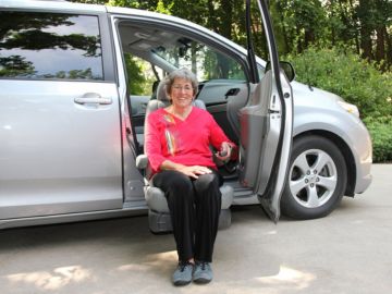 BraunAbility Turny Evo rotating seat lift lowering outside the vehicle for safer wheelchair transfers