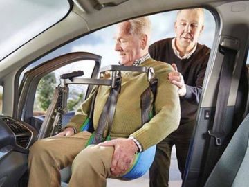 Smart Transfer person lift assisting a passenger into a vehicle seat
